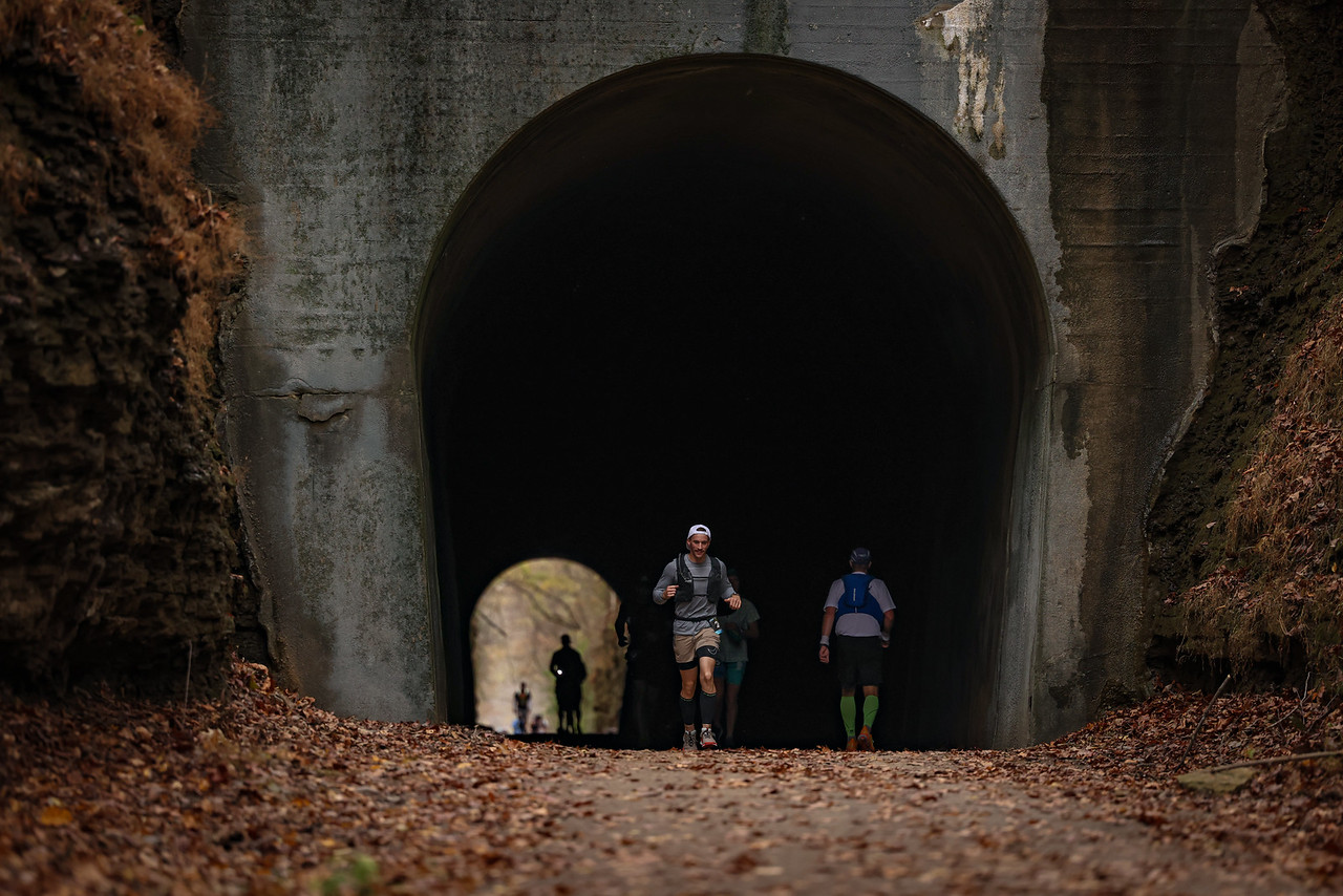 Runners emerging from the double tunnel on the Tunnel Hill course